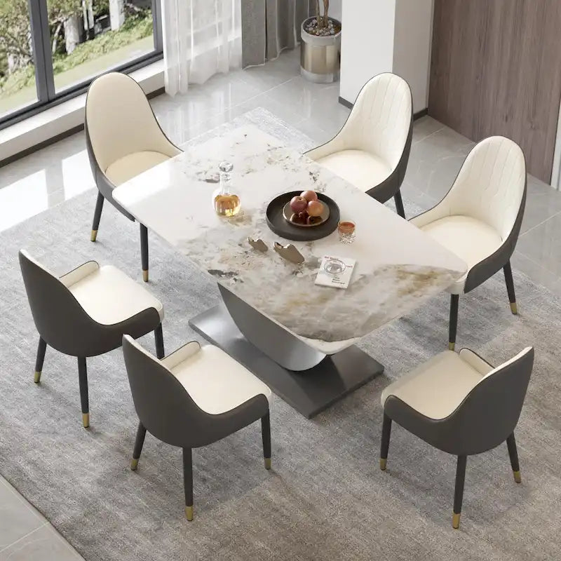 Tavolo da pranzo moderno con piano curvo in pietra sinterizzata e base a forma di luna