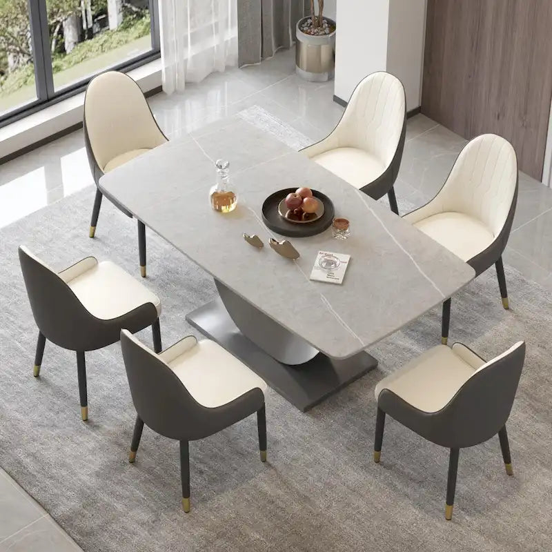 Tavolo da pranzo moderno con piano curvo in pietra sinterizzata e base a forma di luna