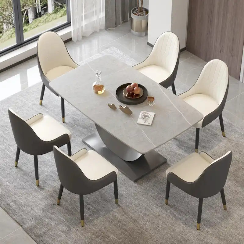 Tavolo da pranzo moderno con piano curvo in pietra sinterizzata e base a forma di luna