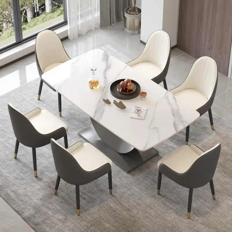 Tavolo da pranzo moderno con piano curvo in pietra sinterizzata e base a forma di luna