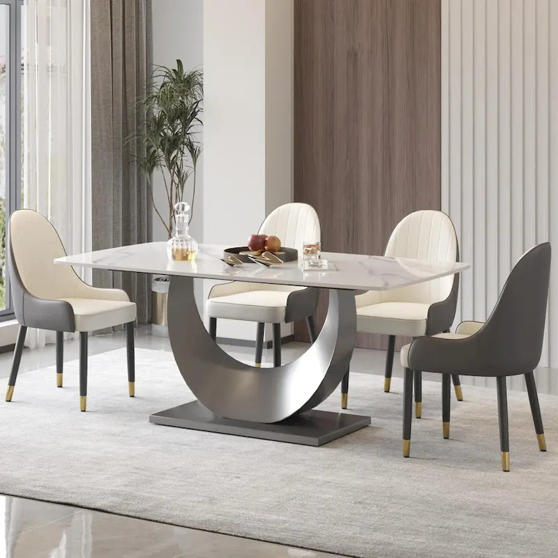 Tavolo da pranzo moderno con piano curvo in pietra sinterizzata e base a forma di luna