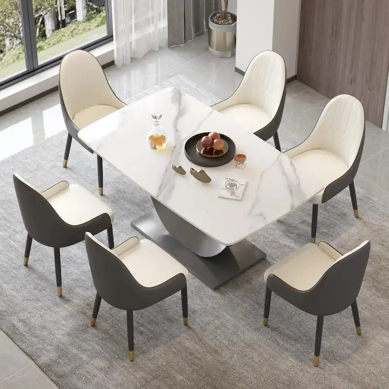 Tavolo da pranzo moderno con piano curvo in pietra sinterizzata e base a forma di luna